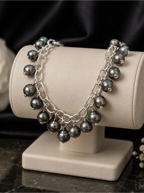 sterling silver bracelet features dangling dark grey pearls
